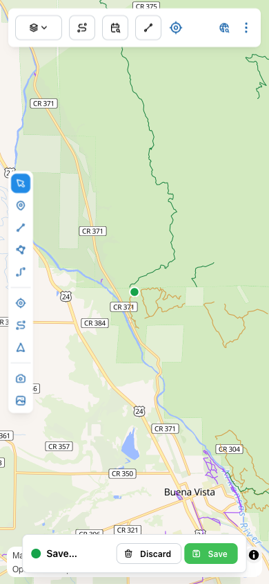 A green dot has been dropped on the map and a Save/Discard bar appears at the bottom of the screen.